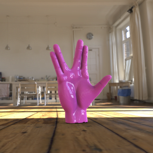 pink spock hand sculpture standin on wooden floor